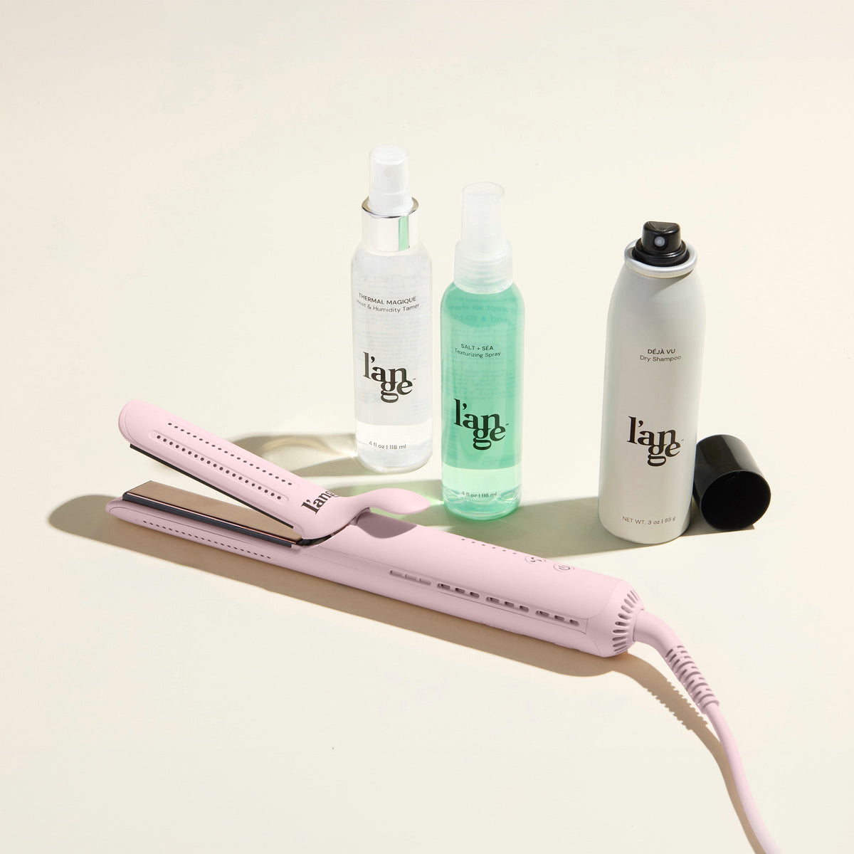 Curl Power Value Set, featuring a Blush Le Duo Classic Standard, Thermal Magique, Salt & Sea,  and Deja Vu, displayed on a beige background