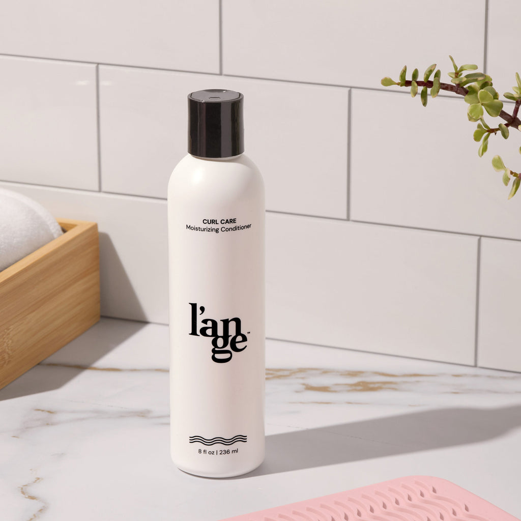 Curl Care Conditioner on vanity..