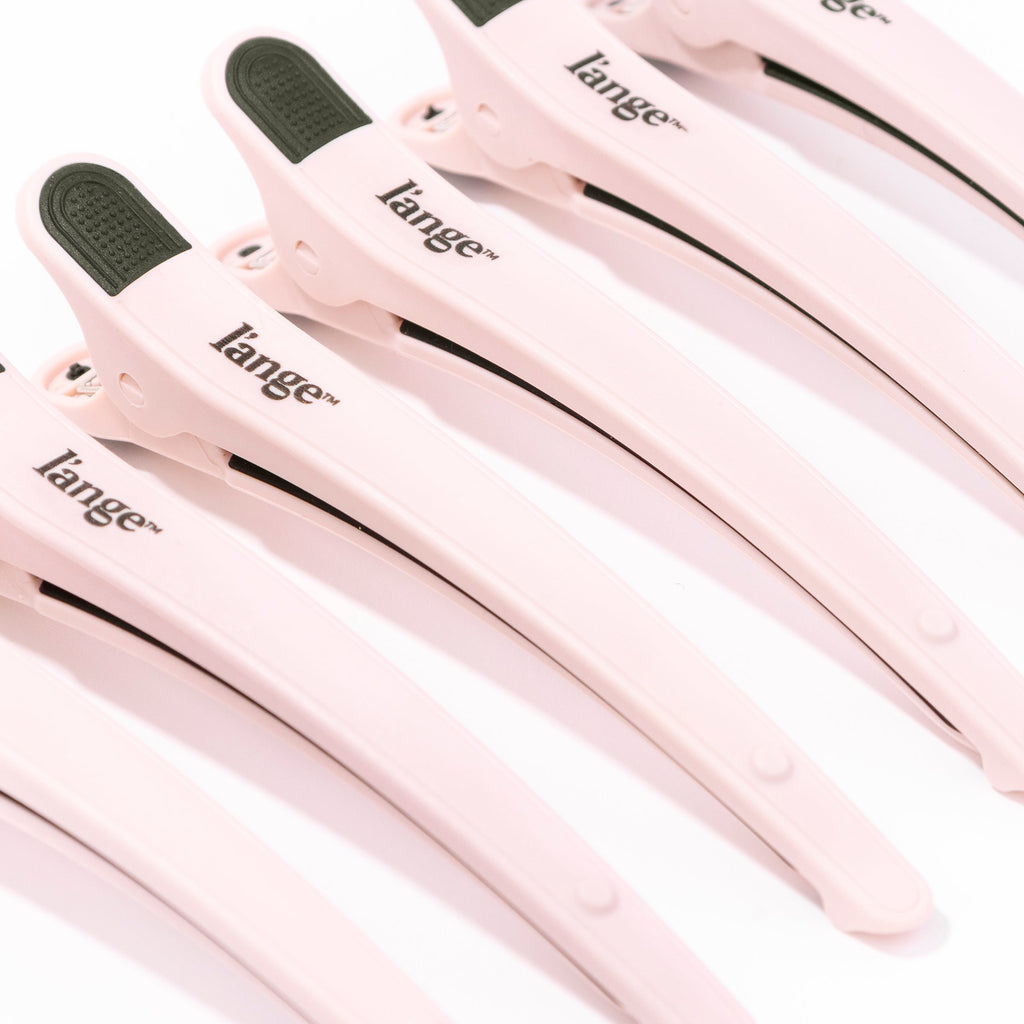 A close up of the sectioning clips shows the long, curved design of these hair clips. 