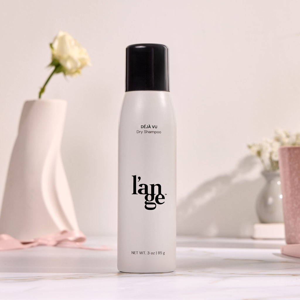 A bottle of Deja Vu on a vanity. 