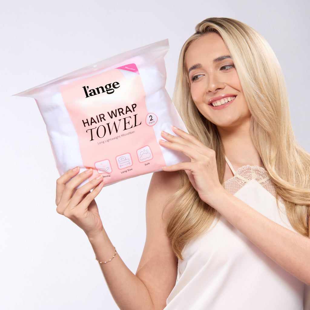 model holding a L'ange hair wrap towel bag
