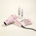 Hot Stuff Blowout Set, featuring a Blush Hot Stuff dryer, Alligator Clips, Thermal Magique, and Satin Nectar, displayed on a beige background