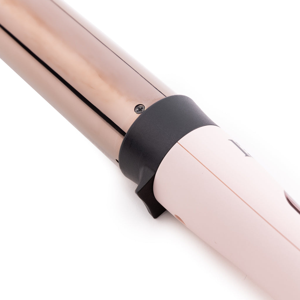 Zoomed in view of blush 32mm titanium barrel with soft touch ergonomic handles 