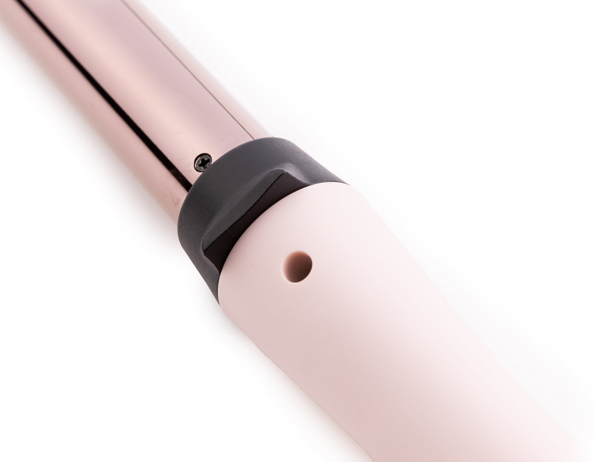 Zoomed in view of blush 25mm titanium barrel with soft touch ergonomic handles 