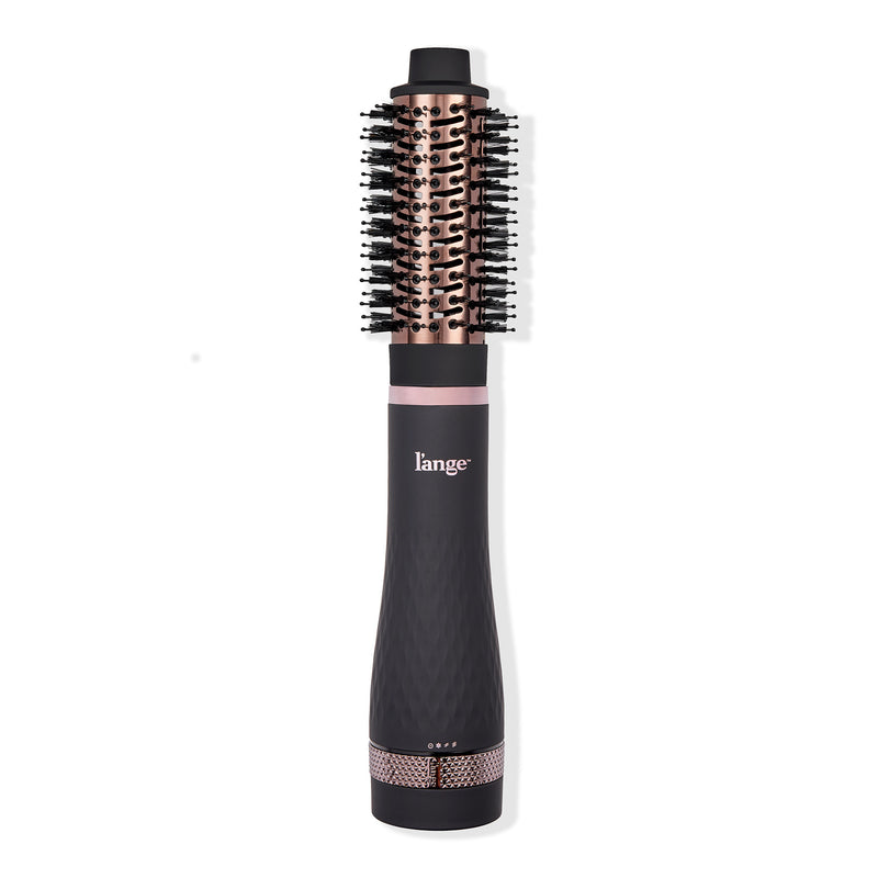 A sleek black and rose gold heated styling brush with a round barrel and bristles, designed for effortless hair styling.