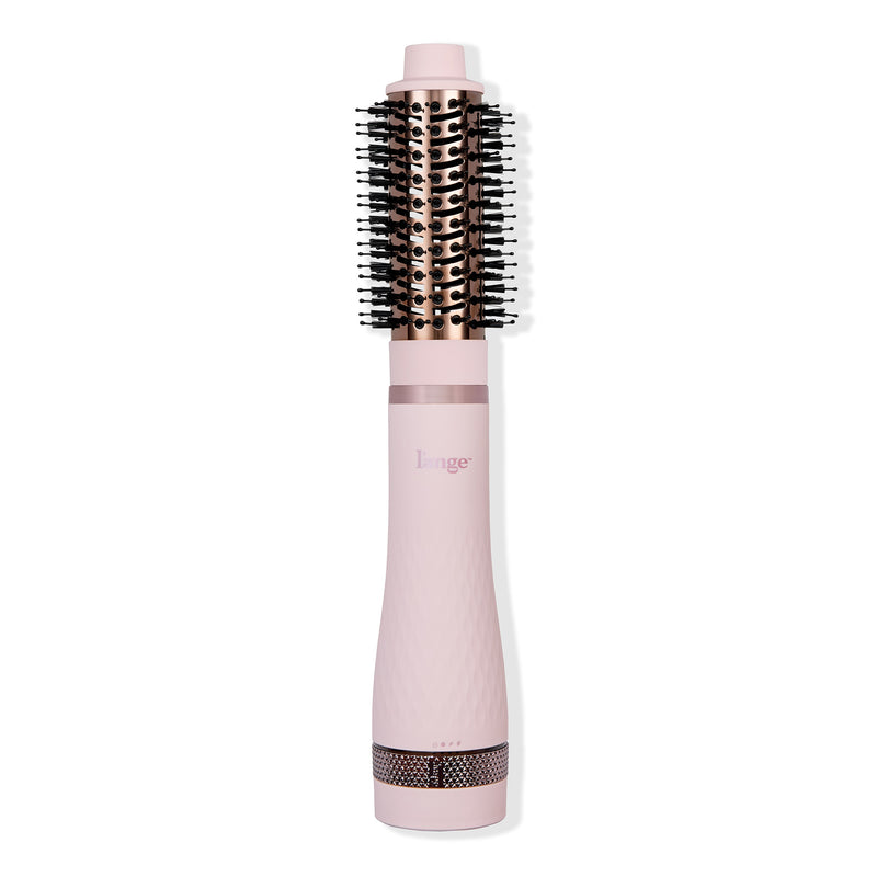 Multi Volume Series 43mm round brush blow dryer in blush pink with rose gold barrel and black bristles.