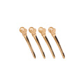 Four gold precision metal hair clips on a white background.