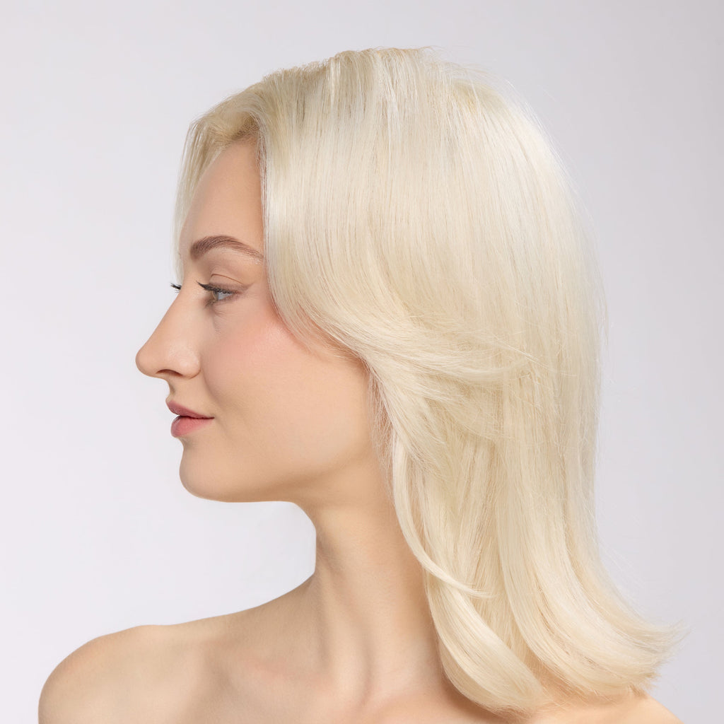 model with voluminous, smooth hair after using thermal rollers