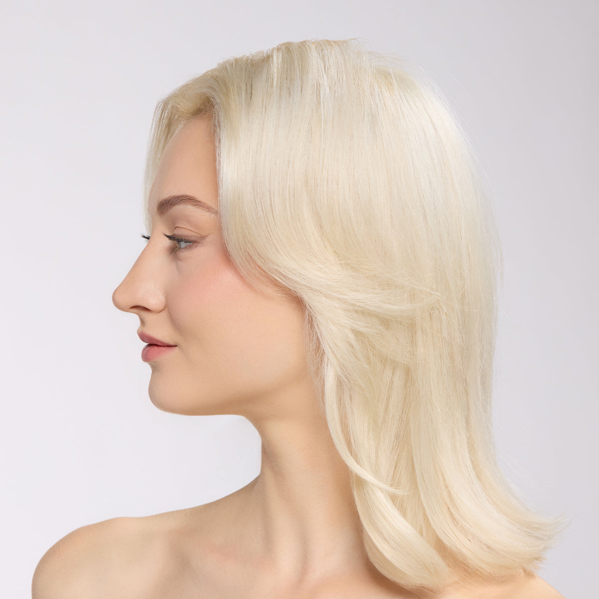 model with voluminous, smooth hair after using thermal rollers