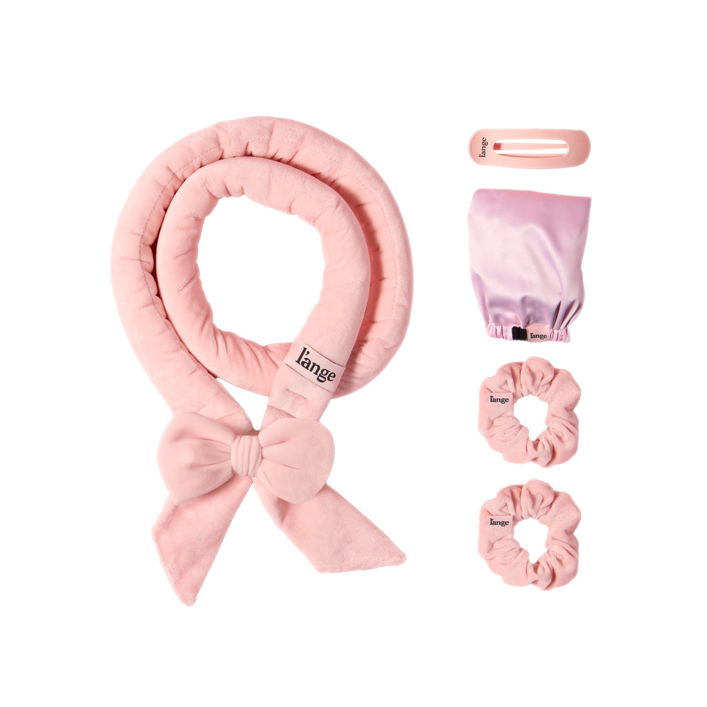 Velvet Heatless Curls Set on a white background.  Set includes curling rod, an adjustable bonnet, two scrunchies, and a hair clip 